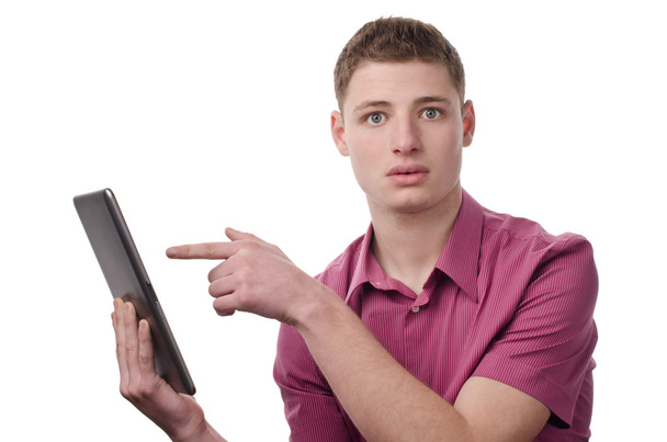 Young man pointing to a tablet. - Foto, afbeelding