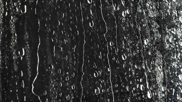 Texture di gocce d'acqua su finestra nera
 - Filmati, video