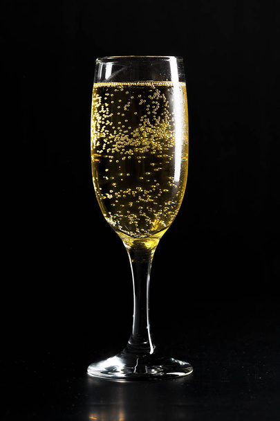 glass of champagne on black background - Photo, Image
