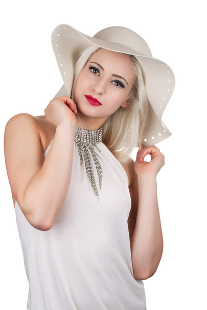 Beautiful young woman with diamond necklace and a hat, isolated - Photo, image