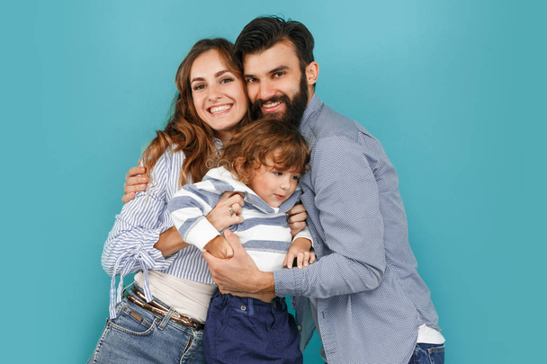 A happy family on blue background - Fotoğraf, Görsel