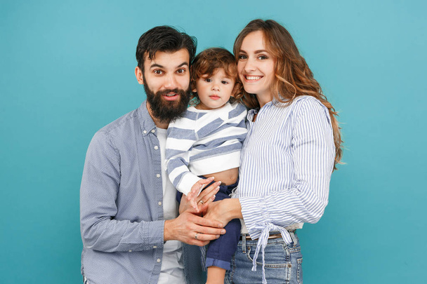 A happy family on blue background - Foto, imagen