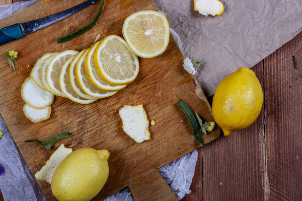 A lot of lemons and oranges on a wooden table. Citrus theme - Valokuva, kuva