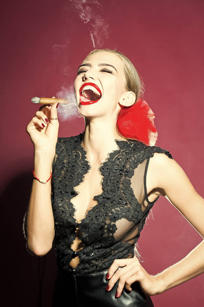 Smoking woman in black lace retro clothing and red bow - Photo, Image