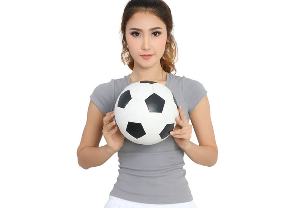 jovem asiático mulher no esporte desgaste segurando futebol em sua mão
 - Foto, Imagem