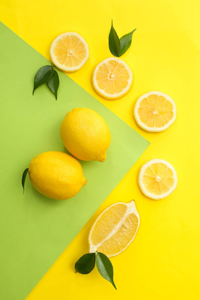 Flat lay composition with ripe juicy lemons on color background - Photo, Image