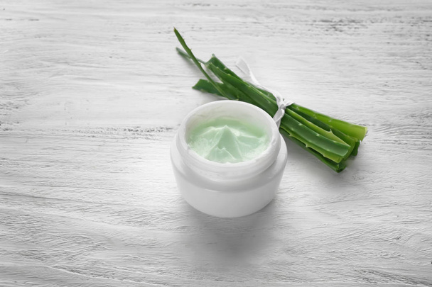 Jar with body cream and aloe vera on white wooden table - Photo, Image