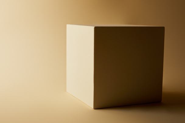 close-up shot of cube on beige surface - Фото, зображення