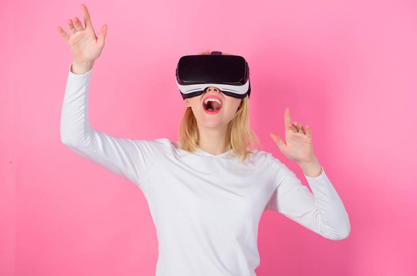 Interact alternative reality. Digital device benefits. Woman head mounted display pink background. Virtual reality and future technologies. Girl use modern technology vr headset. Alternative space - Fotoğraf, Görsel