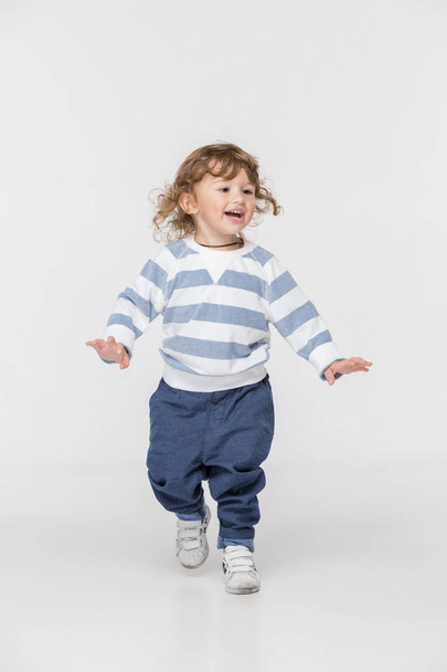Portrait of happy joyful beautiful little boy, studio shot - Foto, Bild