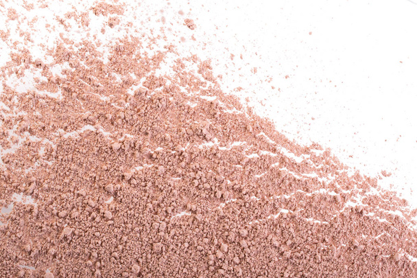 Cosmetic background, minerl clay texture. Pink ask dry clay for facecare and bodycare. Isolated on a white background - Fotografie, Obrázek