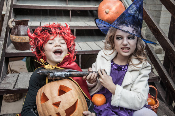 kids in halloween costumes playing outdoor - Foto, immagini