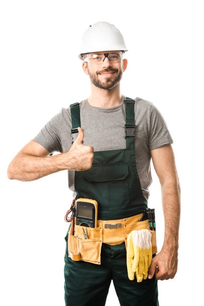 smiling handsome electrician showing thumb up isolated on white - Photo, Image