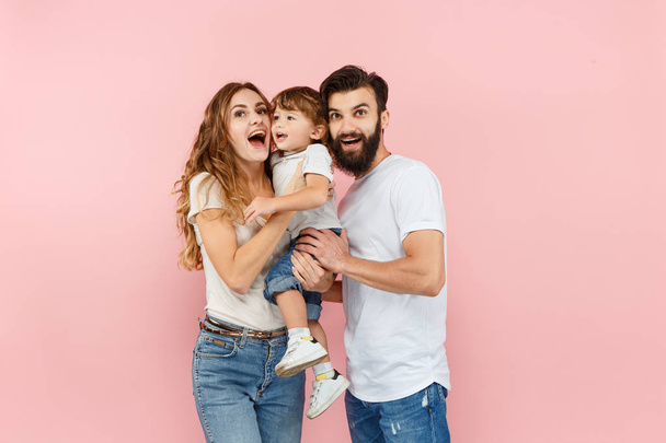 A happy family on pink background - Photo, Image
