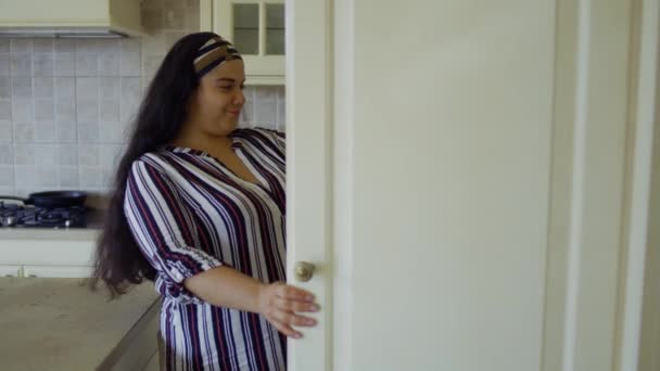 Fat girl opens the refrigerator - Filmati, video