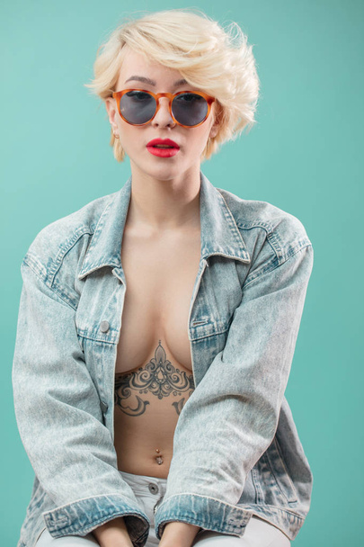 Beautiful awesome girl with stylish make-up and tattooed body - Photo, Image