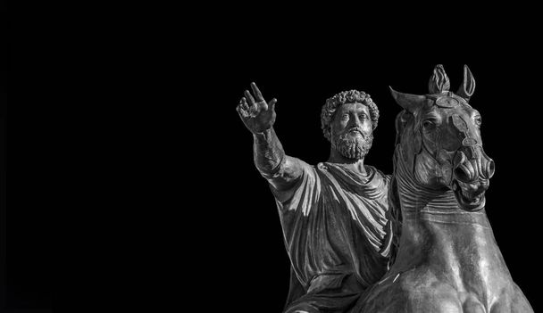 Ancient equestrian monument of emperor Marcus Aurelius, a bronze replica of 2nd century AD statue in the center of Capitol Hill Square in Rome (Black adn White and copy space) - Photo, Image