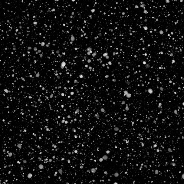 abstract achtergrond met dalende sneeuw op zwarte achtergrond - Foto, afbeelding