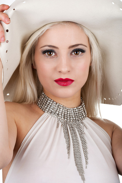 Beautiful young woman with diamond necklace and a hat - Fotoğraf, Görsel