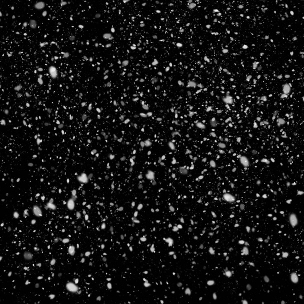 abstract wallpaper with falling snow on black background - Foto, afbeelding