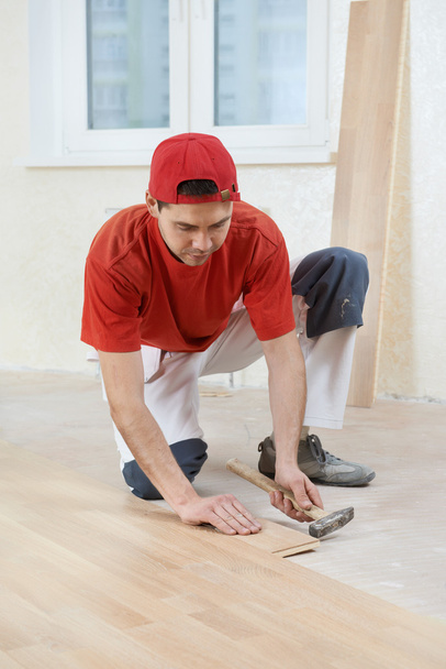 Carpenter worker joining parket floor - Fotoğraf, Görsel