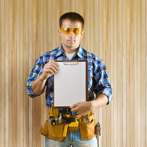 a worker holds clipboard - Foto, Imagem