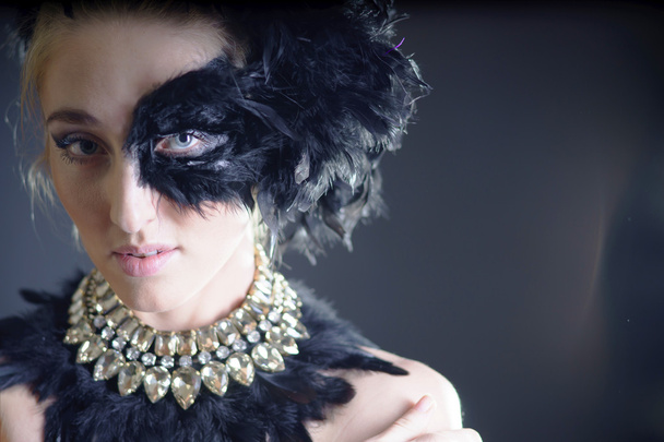 sexy woman with black feather half mask - Fotó, kép