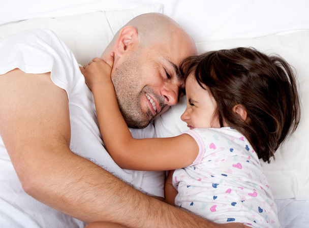 father and daughter playing in bed in the morning - Foto, immagini