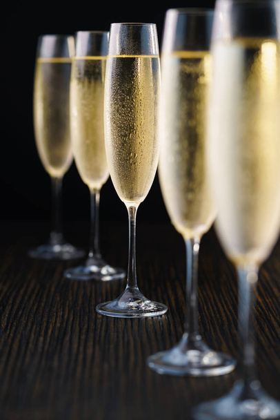 Cold glasses of champagne on black background.Selective focus. - Photo, Image