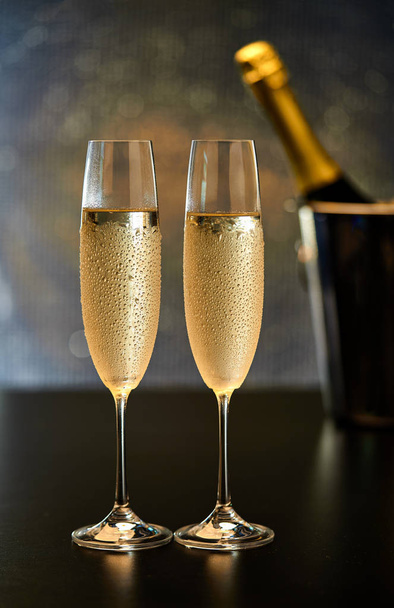 two glasses of champagne on black background.selective focus. - Foto, afbeelding