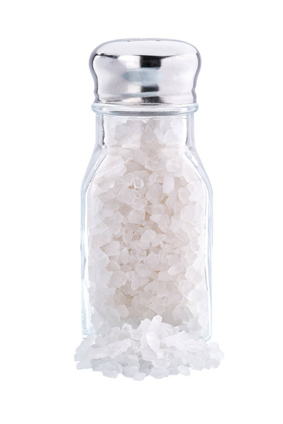 Glas-Salzstreuer isoliert auf weißem Hintergrund. Vertikale Zusammensetzung - Foto, Bild