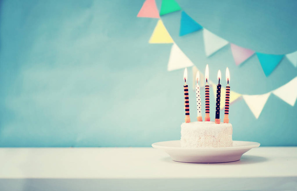 Birthday cake with candles in vintage colors, copy space - Fotó, kép