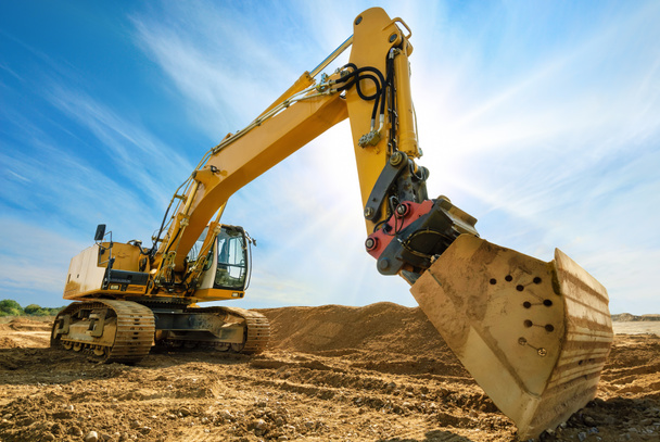 Big excavator in front of the blue sky - Photo, Image