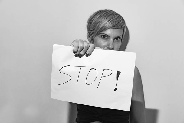 woman holds a baner for stoping the violence against women - Foto, immagini
