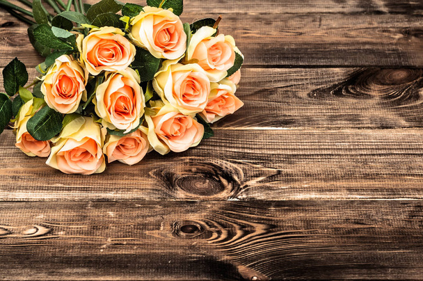 Bouquet of roses, background for mother's day or card for women's day, flowers on wooden table - Foto, imagen