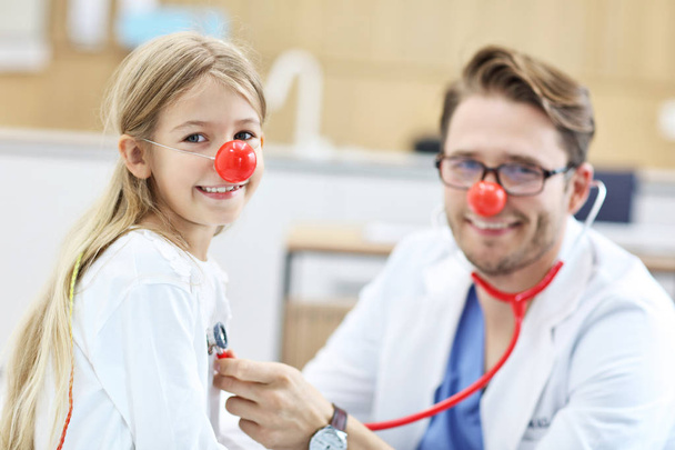 Little girl in clinic having a checkup with pediatrician - Photo, Image