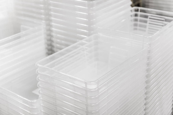 Folded transparent plastic containers boxes at store - Foto, Imagem
