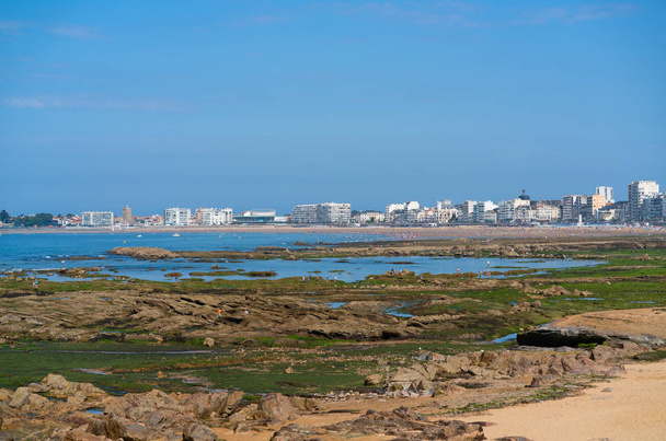 Distant panorama view of the beach rocks and cityscape of Les Sables d Olonne in Vendee France - Photo, Image