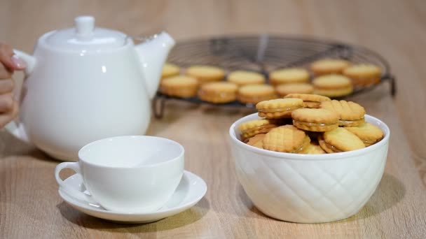 A cup of tea with cookies. Cookies with caramel dulce de leche. - Footage, Video