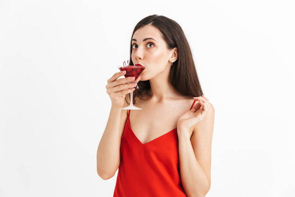 Photo of young happy excited woman posing isolated drinking cocktail. - Zdjęcie, obraz