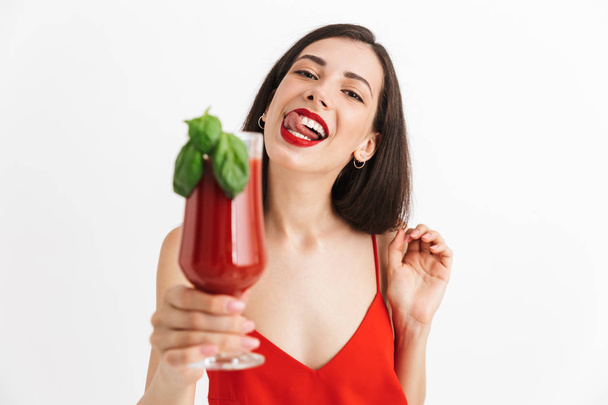Photo of young happy excited woman posing isolated drinking cocktail. - Фото, зображення