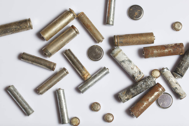 The fulfilled batteries of the different size covered with corrosion. Recycling. - Photo, Image