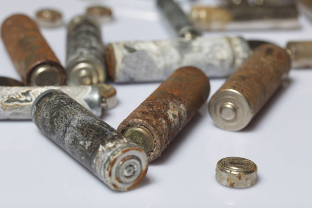 The fulfilled batteries of the different size covered with corrosion. Recycling. - Photo, Image