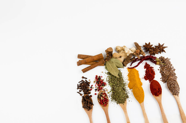 Mixed various spices on the white background - Фото, изображение