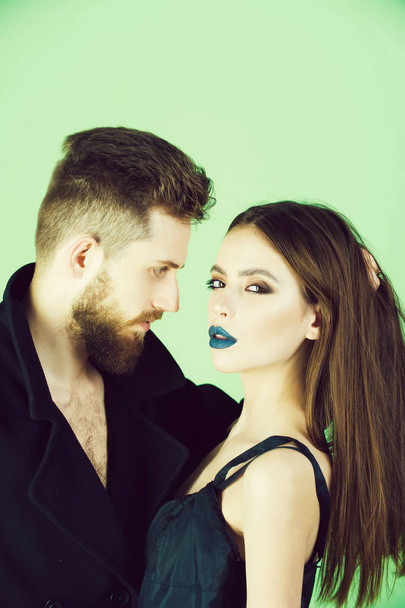 beautiful fashion couple in love on green background - 写真・画像