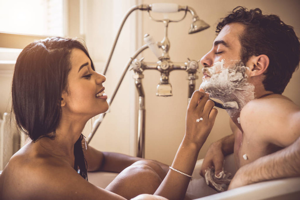 Young cheerful couple at home - Intimate moments, couple bathing - Fotografie, Obrázek