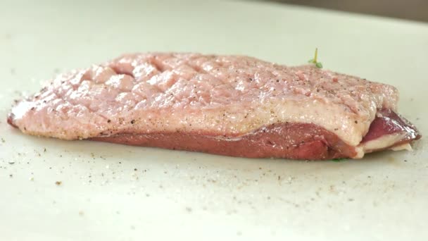 Raw meat with rosemary. - Video, Çekim