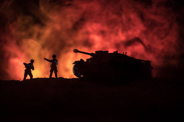 War Concept. Military silhouettes fighting scene on war fog sky background, World War German Tanks Silhouettes Below Cloudy Skyline At night. Attack scene. Armored vehicles. Tanks battle - Zdjęcie, obraz