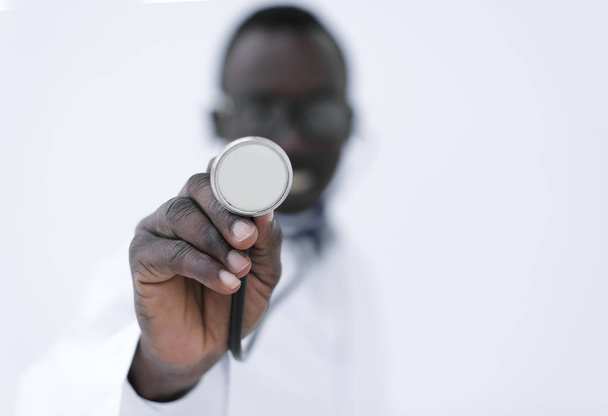 close up.doctor is a therapist holding out a stethoscope - Fotoğraf, Görsel