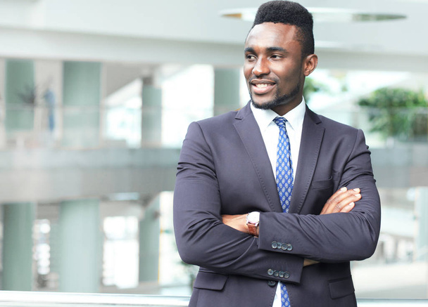 Successful African American businessman businessman standing in office. - Foto, Imagem